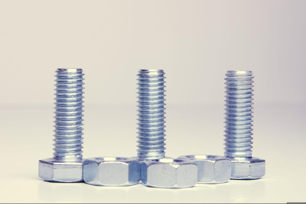 Close-up of zinc-plated steel fasteners with a bright metallic finish